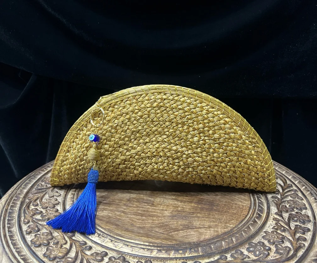 Half-moon tassel clutch
